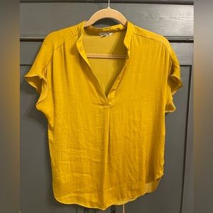 Naked Zebra short sleeve silky blouse. Small hole